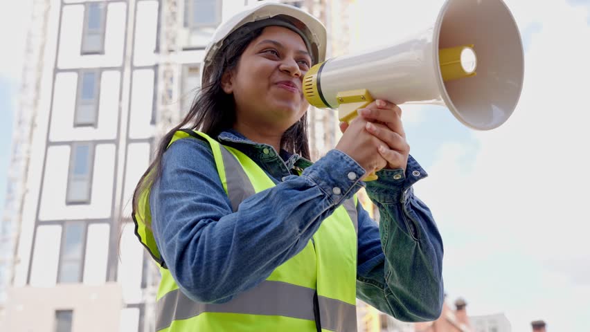 Construction worker leads team meeting with enthusiasm at downtown site during bright afternoon - Powered by Shutterstock - Get 15% off with code: PIKWIZARD15