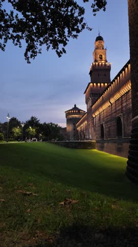 Main entrance to the Sforza Castle and tower - Castello Sforzesco night, Milan, Italy