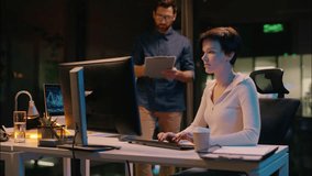 Business woman man in night office crypto online computer trading cooperation businessman businesswoman Caucasian colleagues co-workers employees teamwork mentoring boss intern overtime evening work - Powered by Shutterstock - Get 15% off with code: PIKWIZARD15