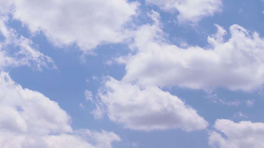 Soft white clouds race across a bright blue summer sky in fast-motion time-lapse loop, conveying clarity, lightness and expansive freedom—perfect for backgrounds, transitions, or uplifting nature.