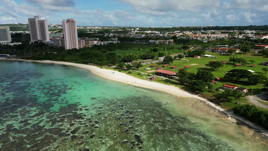 Turquoise Sea And Pavilions At Ypao Beach In Tumon, Guam, United States. Aerial Drone Shot