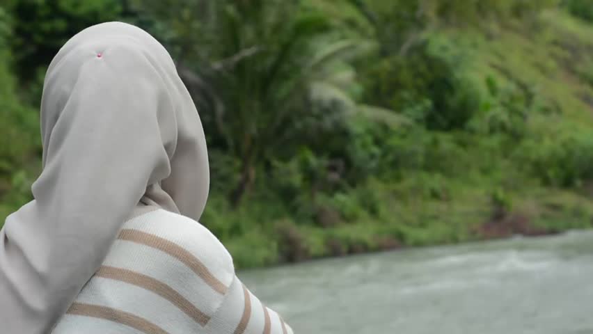 Maintenance woman engineer working at hydroelectric power plant. Renewable energy system.