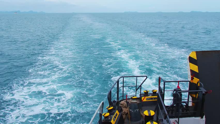 Ocean Voyage: A ship's wake carves a foamy path across the sea, revealing the vastness and raw power of the open ocean. This photograph captures the essence of maritime travel, solitude.