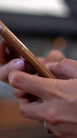 Close up of asian woman using smartphone. Female hand hold and touch screen cell phone. People surfing internet, checks social network and write text on device mobile