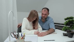Teacher assists student in understanding concepts at a desk, highlighting the connection and interaction in a nurturing learning atmosphere. teacher day - Powered by Shutterstock - Get 15% off with code: PIKWIZARD15