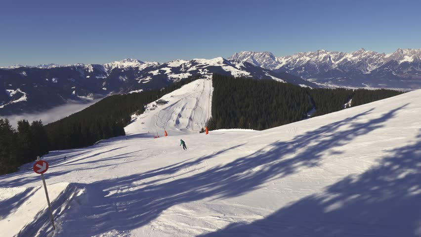 Empty Ski Slope in Zell am See Ski Resort, Sunny Winter Alps Landscape