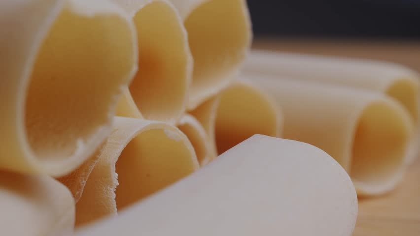 Raw Italian spanish Cannelloni Pasta in supermarket texture close up. Cooking background. Italian food concept.