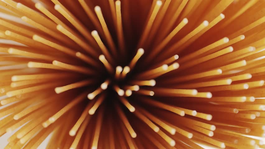 Wholegrain noodle background. Organic whole wheat spaghetti pasta, raw and dry.