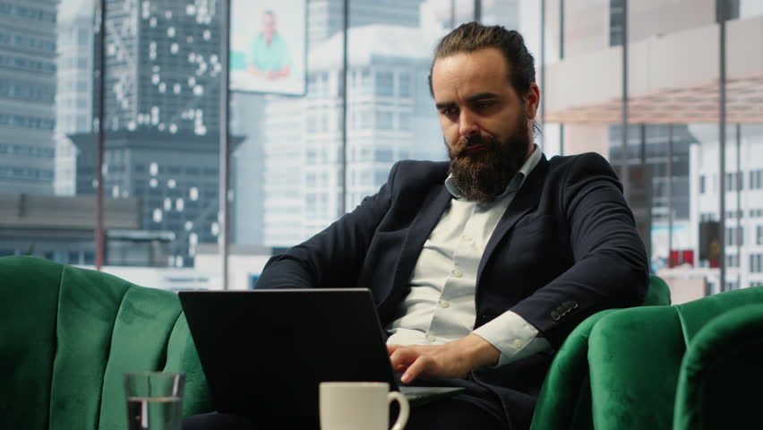 Worried hopeless businessman working under pressure in despair, struggling with corporate downfall and battling the stress of a financial crisis. Business failure and problems. Camera B.