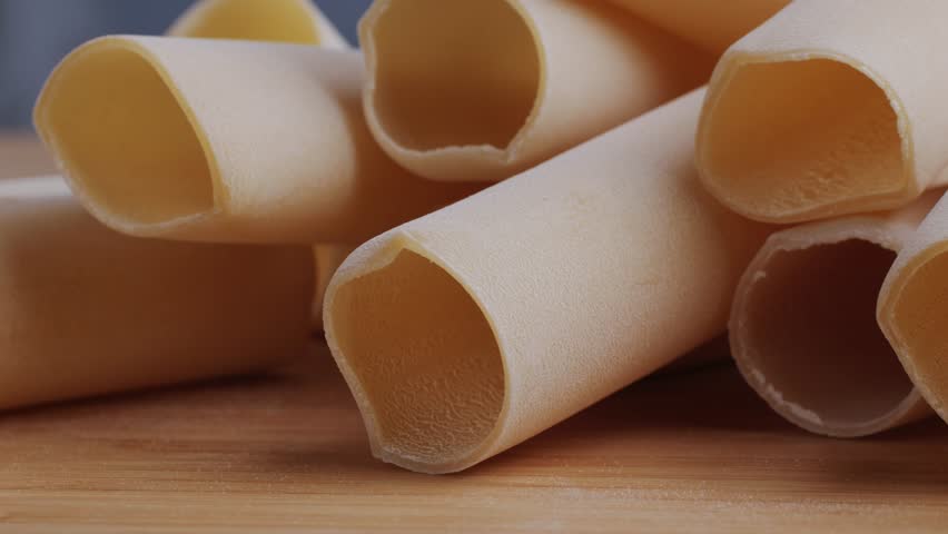 Raw Italian spanish Cannelloni Pasta in supermarket texture close up. Cooking background. Italian food concept.
