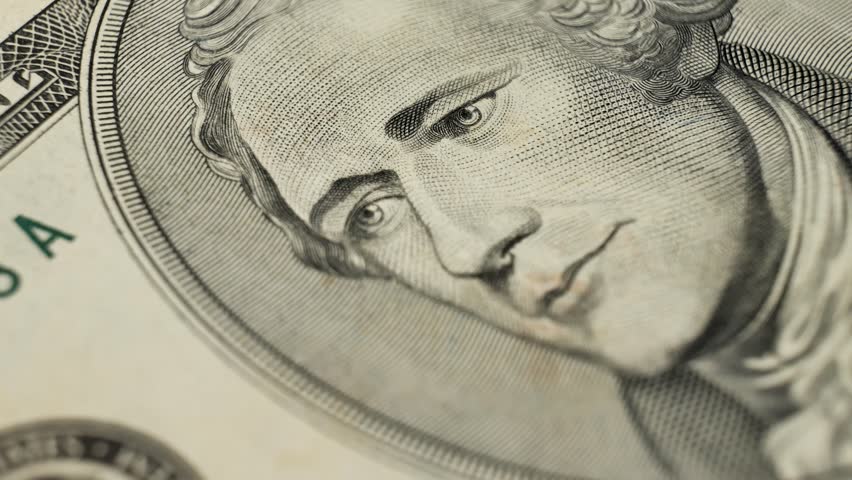 Artistic representation of male portrait Alexander Hamilton on banknote. Visible security features. Paper fibers on USA money. Budgeting expenses with physical currency on hand