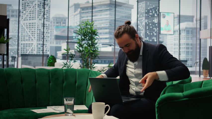 Proud satisfied CEO mimics air guitar singing and celebrating achievement, happy with the road to business success. Happy excited entrepreneur acting silly and cheerful in office. Camera A.