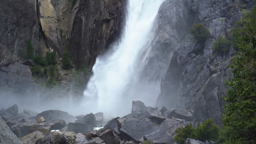 Lower Yosemite Falls still shot with water crashing down on rocks below. 
