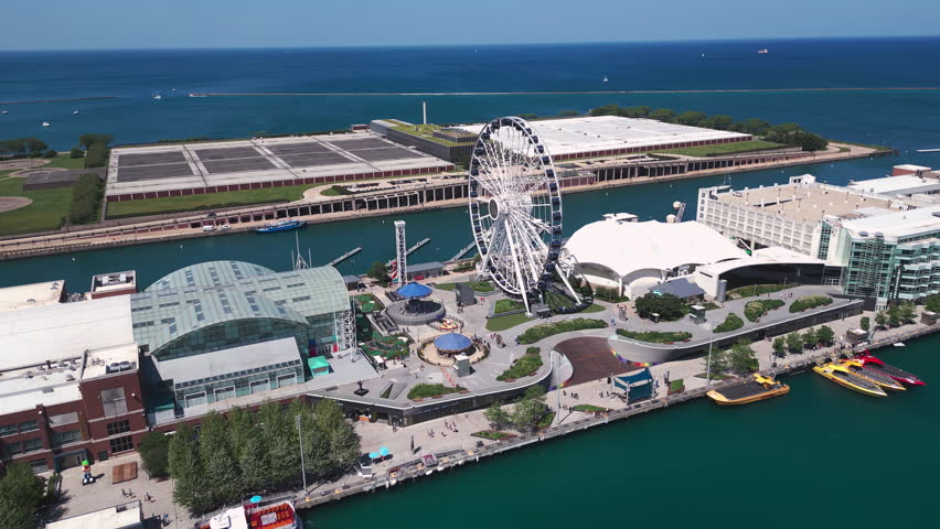 Aerial of Chicago Navy Pier entertainment district with ferris wheel. 