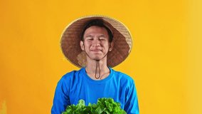 Smiling farmer proudly presents fresh produce showcasing healthy harvest and agricultural bounty - Powered by Shutterstock - Get 15% off with code: PIKWIZARD15