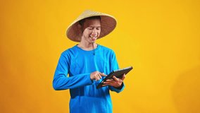 Young farmer skillfully uses tablet device for modern agricultural management and data analysis - Powered by Shutterstock - Get 15% off with code: PIKWIZARD15
