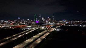 Dallas skyline hyperlapse at night with traffic and buildings.  - Powered by Shutterstock - Get 15% off with code: PIKWIZARD15