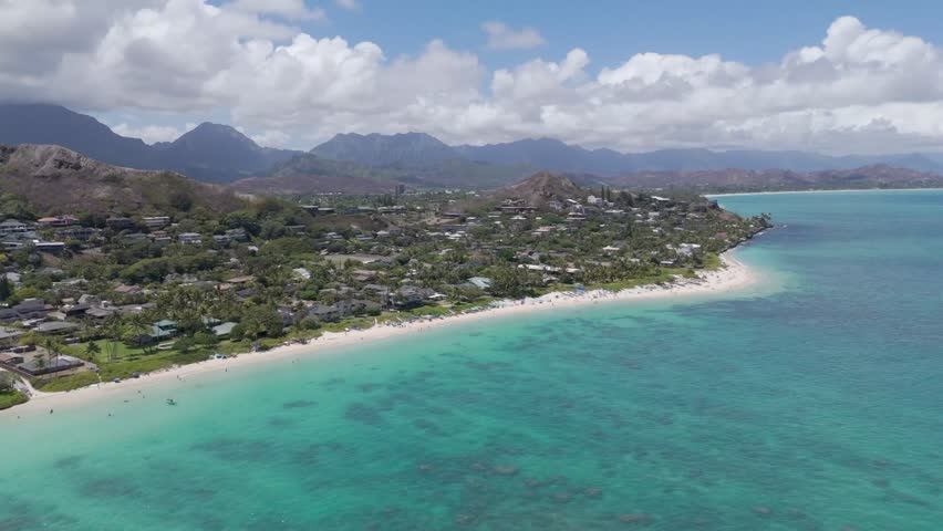 Stunning aerial view of Lanikai Beach with turquoise waters, golden sands, and the iconic Mokulua Islands.