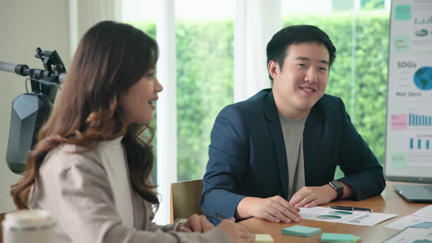 Happy workplace diverse team group young adult gen Z asia people man woman candid work at office class enjoy talk laugh relax idea advice in go green eco friendly future growth worker mental health.