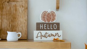 Fall season decor pumpkin sign says hello autumn with small pitcher and leaves - Powered by Shutterstock - Get 15% off with code: PIKWIZARD15