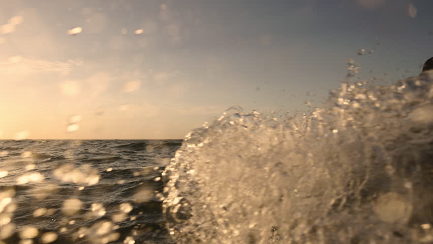 Kitesurfer riding waves in tropical paradise sunset light creating splash symbol of summer vibes freedom happiness lifestyle adventure commercial vacation travel destination exotic holiday inspiration