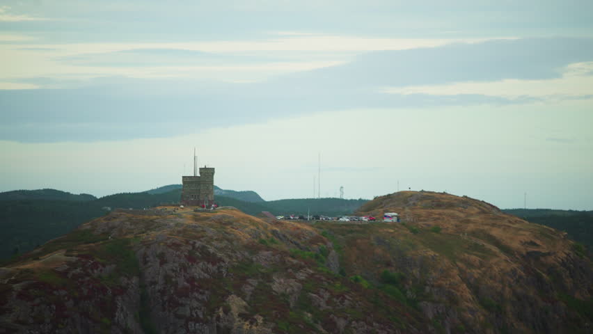 Aerial shot overlooking castle on edge of cliff during a cloudy fall day. Signal Hill. St. Johns, Newfoundland Canada.