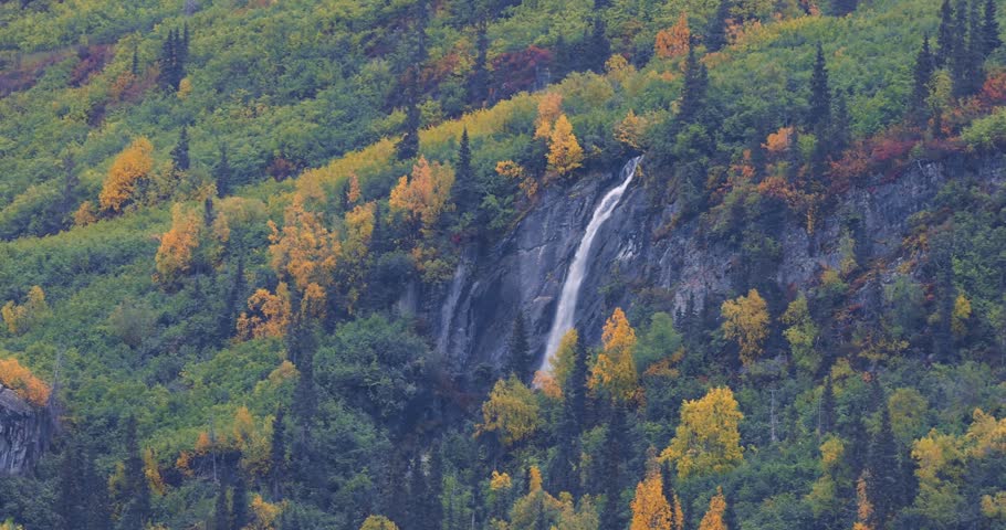 Scenic view of glacial waterfalls along Richardson Highway near Valdez city in Alaska.