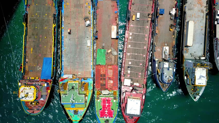 Aerial top down view of colorful old ships and boats at the dock in Nassau, Bahamas.