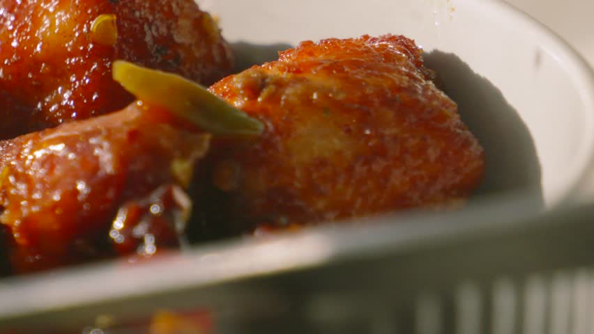 Delicious Sticky Sweet and Sour Chicken with Chilli in Bowl Ready to Eat in Natural Light.