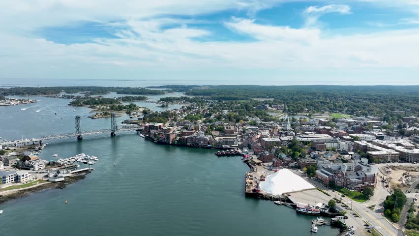 Aerial view of Portsmouth, NH showing the Piscataqua River and downtown skyline in the background.