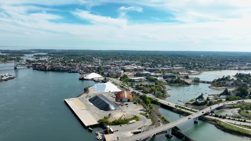 Aerial view of Portsmouth, NH showing the Piscataqua River and downtown skyline in the background.