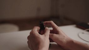 Skilled technician male operating gas lighter, adjusting flame with precision in workshop environment, preparing for detailed task requiring controlled heat, close-up. Shooting in slow motion. - Powered by Shutterstock - Get 15% off with code: PIKWIZARD15