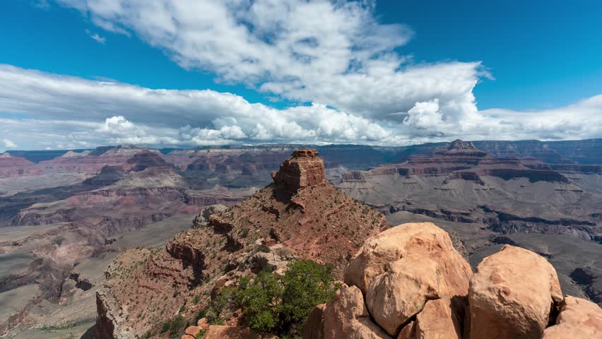 Time lapse of the Grand Canyon national park with blue sky and big clouds over wide landscape