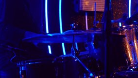 Drum player close-up during live concert, highlighting music talent, percussion instruments, and stage performance - Powered by Shutterstock - Get 15% off with code: PIKWIZARD15