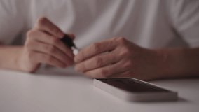 Close-up of male hands connecting OTG cable to smartphone, enabling data transfer, device charging and peripheral connection, showcasing mobile connectivity and technology integration, slow motion. - Powered by Shutterstock - Get 15% off with code: PIKWIZARD15