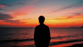 Pensive Young Man Silhouette Standing on Beach at Sunset Over Ocean, Golden Hour Sky Reflecting on Water Surface - Powered by Shutterstock - Get 15% off with code: PIKWIZARD15