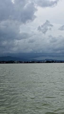 Storm Clouds Over Lake with Mountain View

