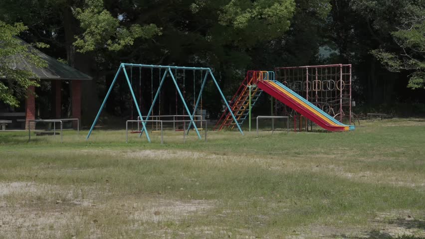 A ruin in Uwajima Castle, one of Japan's Top 100 Castles. Now, colorful children's amusement facilities such as swings and slides stand on this open space.