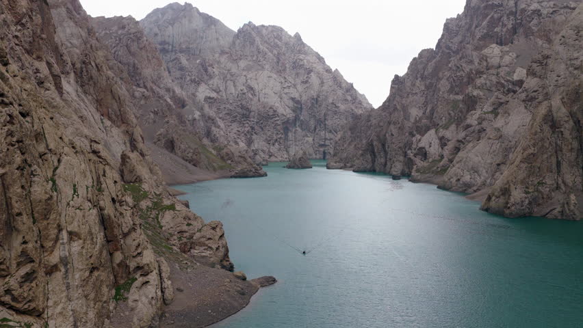 Köl-Suu Alpine Lake In Kyrgyzstan During Rainy Season - Aerial Drone Shot