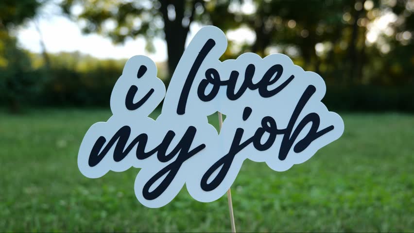 Message of the words I Love My Job Outdoors in Nature at Dusk 4k Video Stock Footage