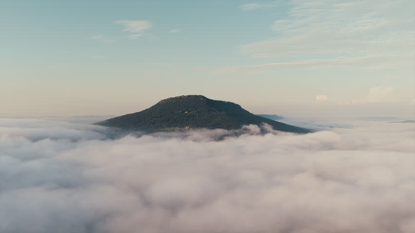 Drone shot of Lookout Mountain, Chattanooga, Tennessee, emerging above a thick layer of morning fog.