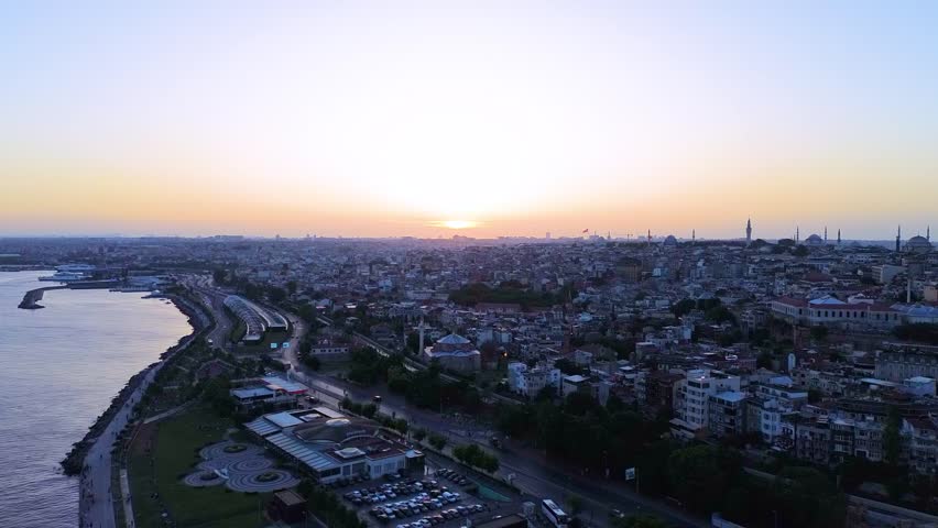 Aerial view of the sun setting over Istanbul and adjacent Marmara sea.