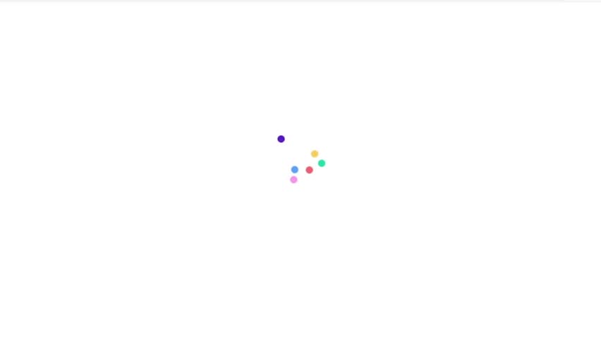 A small cluster of colorful dots arranged in a circular pattern against a white background.