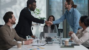 Multinational businessmen shaking hands handshake agreement success business deal offer financial team client partners businesswomen multiethnic women men negotiation cooperation office coworkers meet - Powered by Shutterstock - Get 15% off with code: PIKWIZARD15