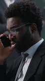 Worried stressed African American businessman employee manager talking mobile phone cellphone call discuss consult client reading business contract document paperwork trouble worker in office report - Powered by Shutterstock - Get 15% off with code: PIKWIZARD15