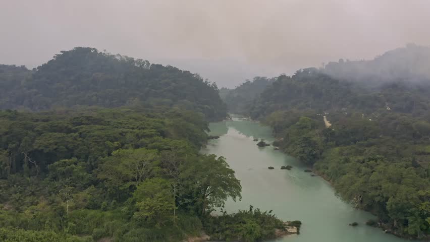 An awe-inspiring aerial drone shot captures the stunning natural beauty of Agua Clara in Chiapas, Mexico.