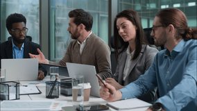 Multiethnic business group teamwork African American and Caucasian men woman businesspeople in office talking presenting graph chart analyzing statistic coworkers partners discuss diversity colleagues - Powered by Shutterstock - Get 15% off with code: PIKWIZARD15