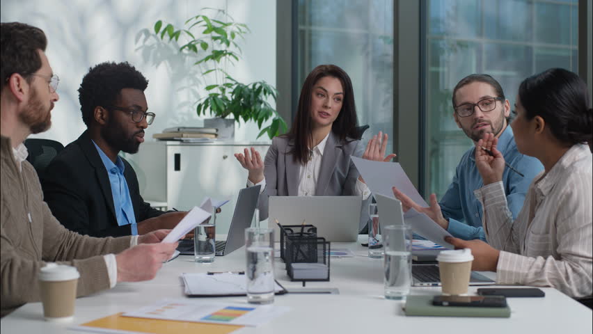 Multiracial business group teamwork businesspeople women men sharing graphs charts documents analyzing statistics discussing project coworkers briefing planning strategy diverse females males office - Powered by Shutterstock - Get 15% off with code: PIKWIZARD15