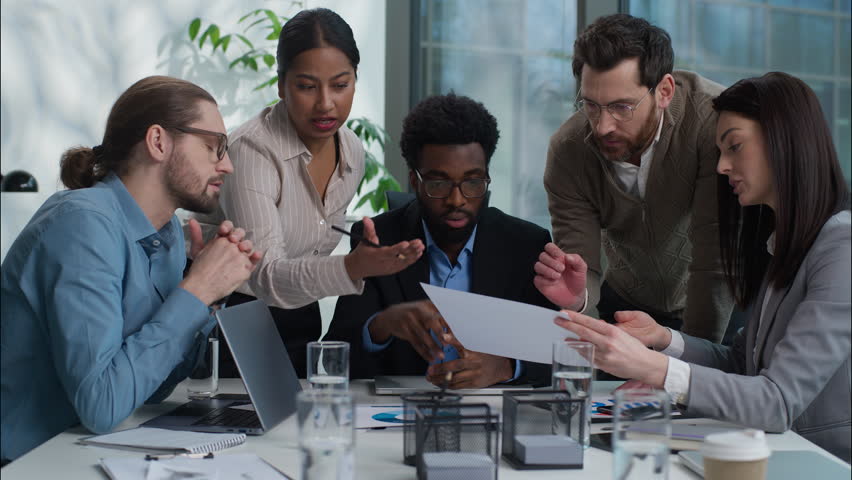 Business team multiracial group talking discussion graph chart document report analyzing men women in office coworkers African American Indian Caucasian businesswomen businessmen solve plan strategy - Powered by Shutterstock - Get 15% off with code: PIKWIZARD15
