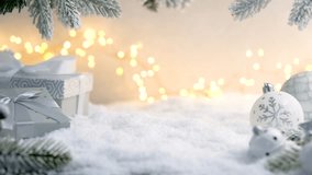 Christmas Holiday background with snow, fir tree gift box and decorations with christmas light behind. Christmas balls on a winter festive background. - Powered by Shutterstock - Get 15% off with code: PIKWIZARD15